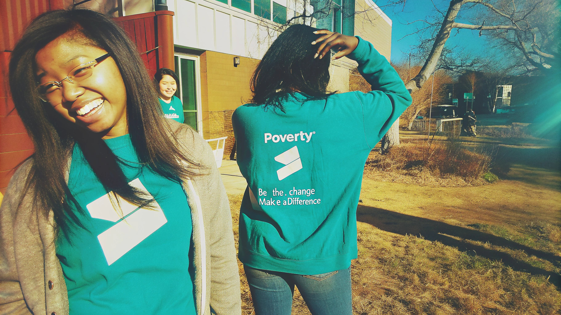 Volunteers wearing PovertyX shirts