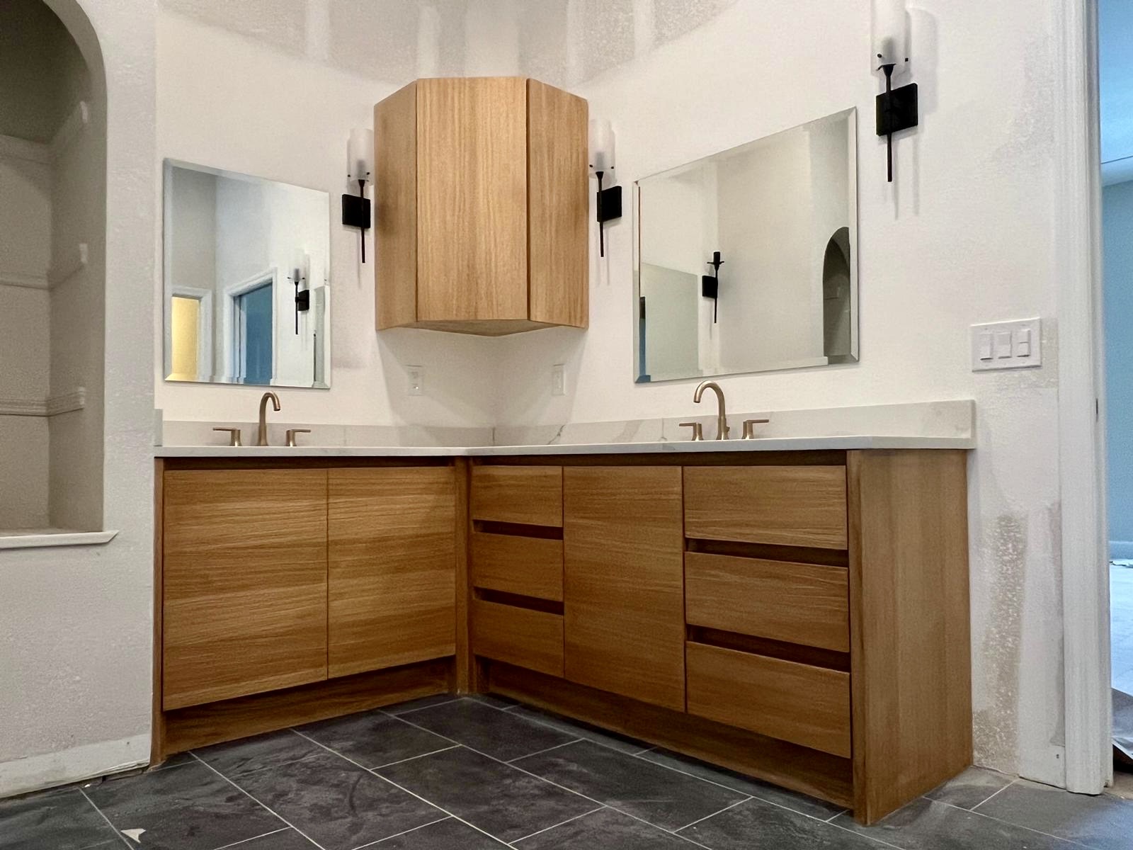 Luxury master bathroom with custom wood double vanity and marble countertops by Kaplan Remodeling in Winter Park FL