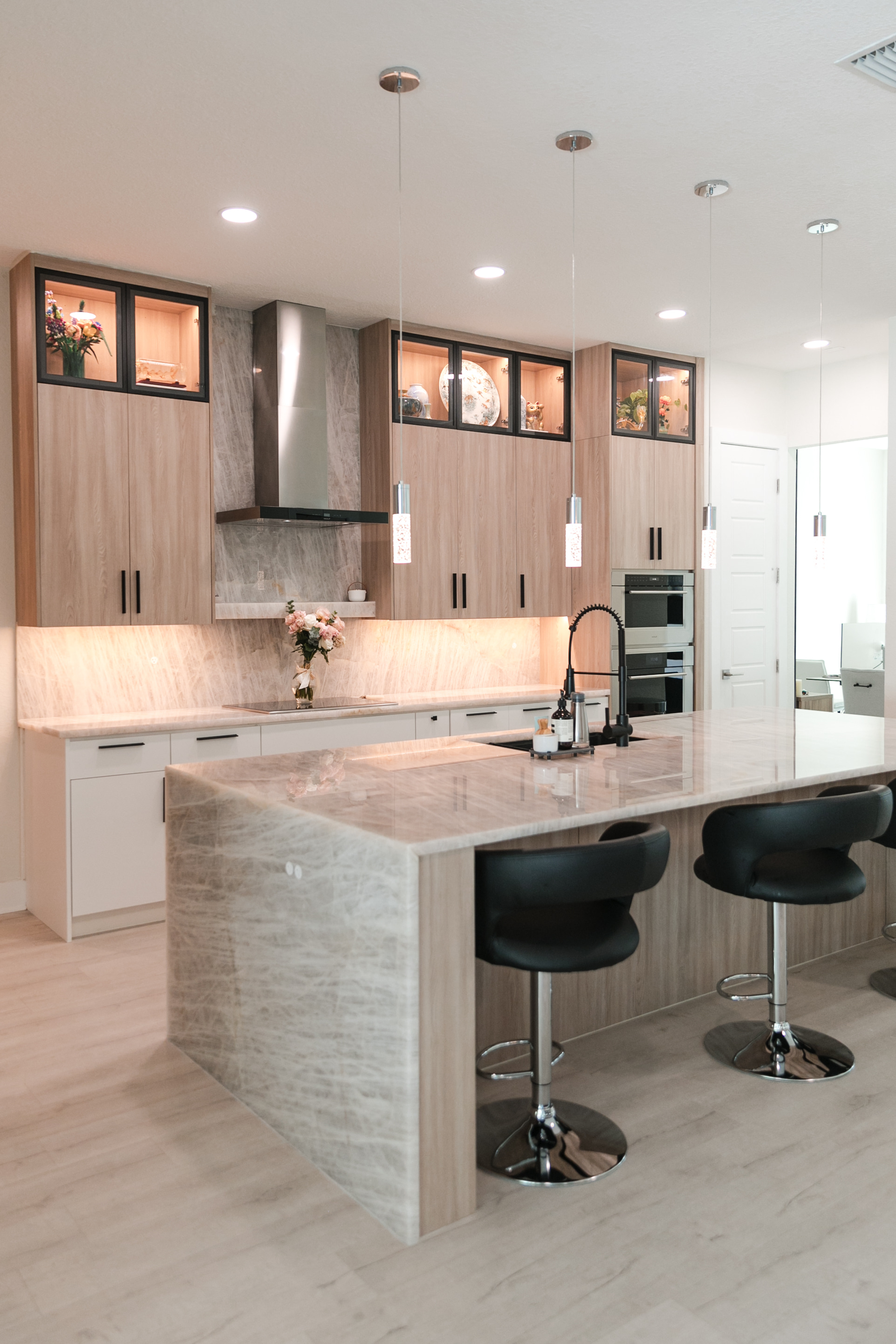 Open concept kitchen design with large island and professional appliances by Kaplan Remodeling in Windermere FL