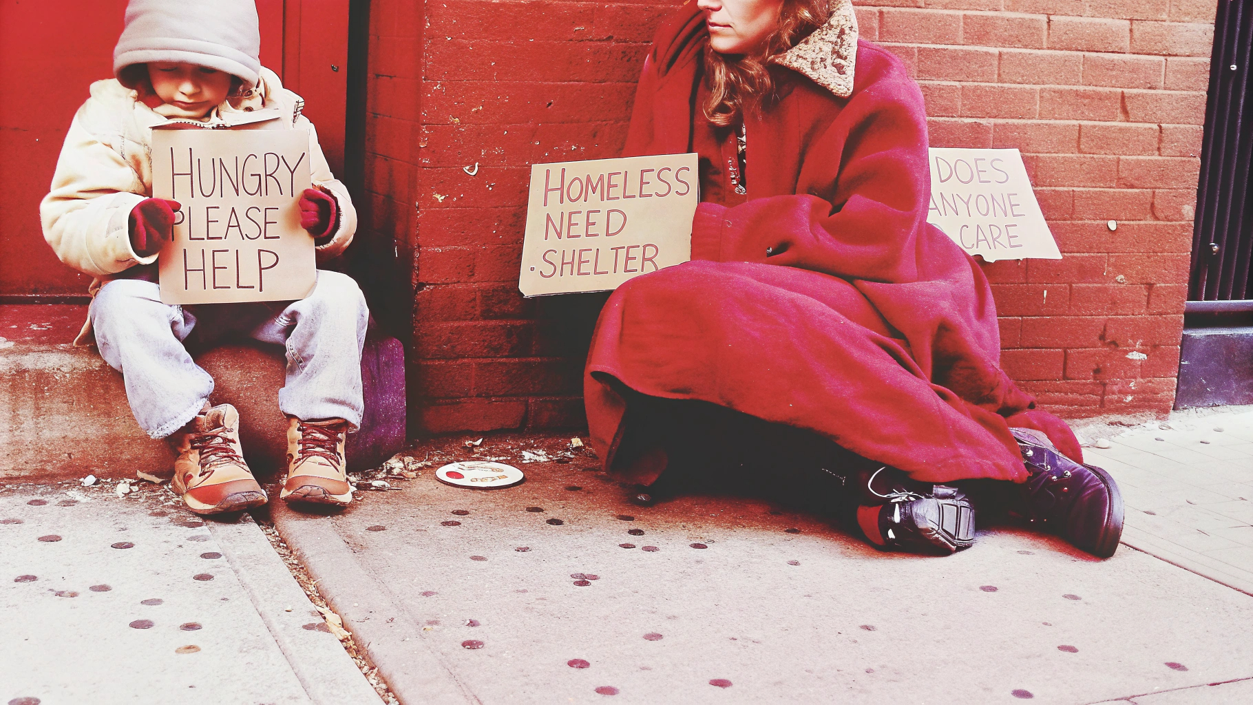 Child and woman with help signs