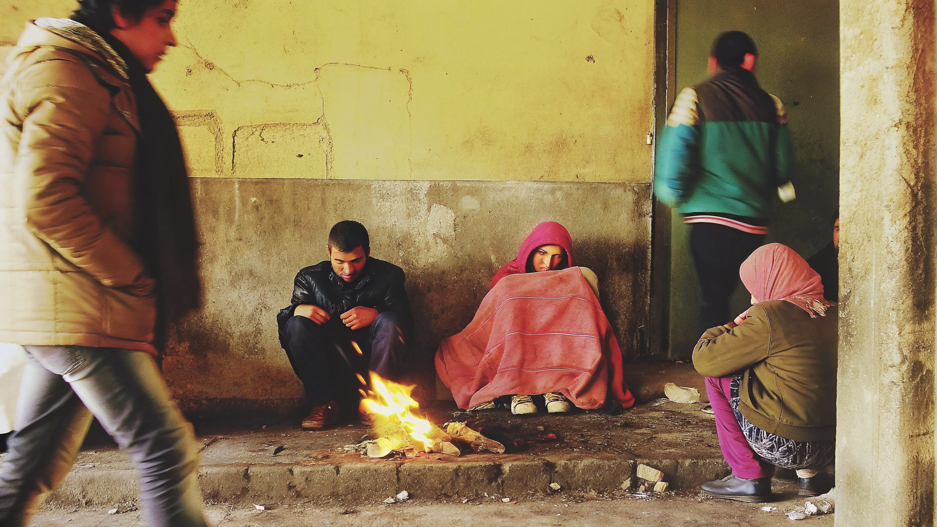 Family warming by small fire
