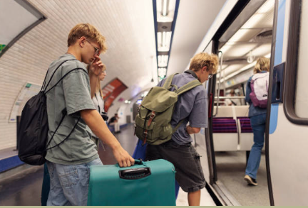Transportation: busy metro station platform with arriving train