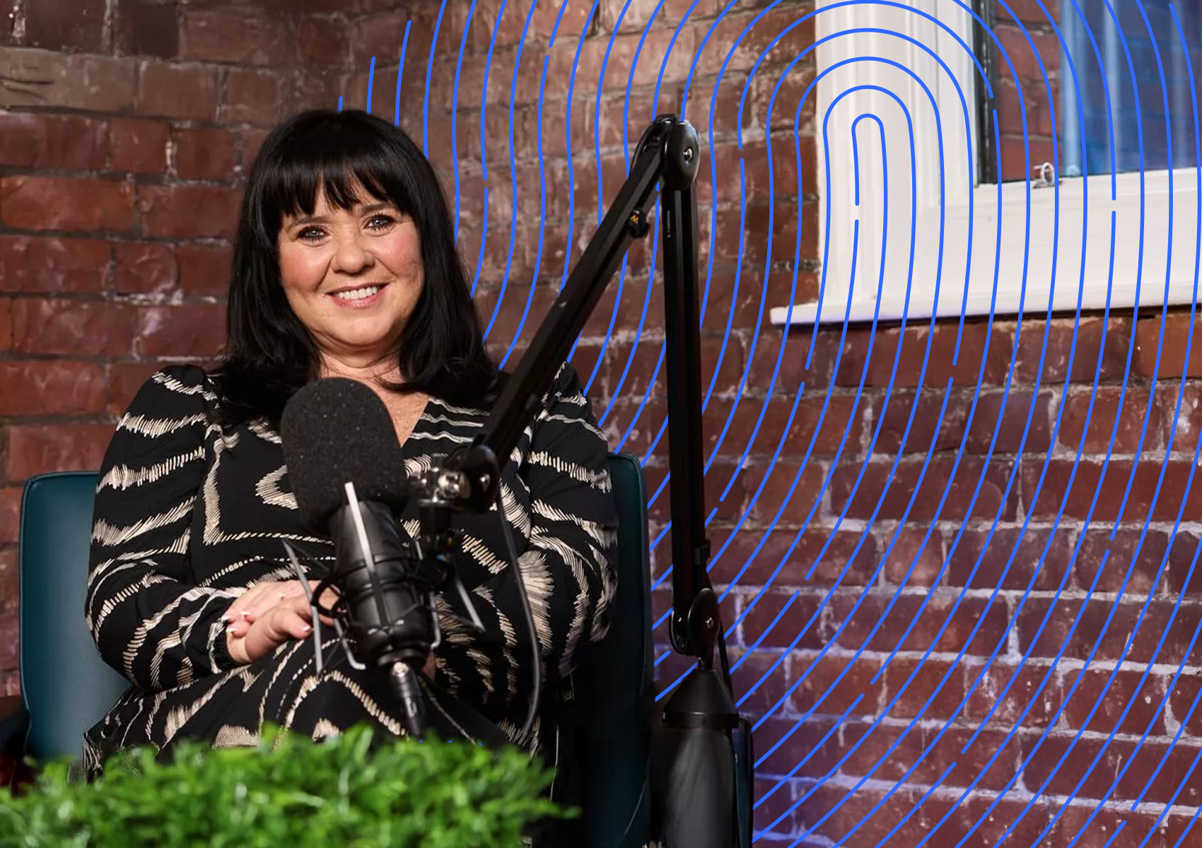Lady Sitting with Podcast equipment