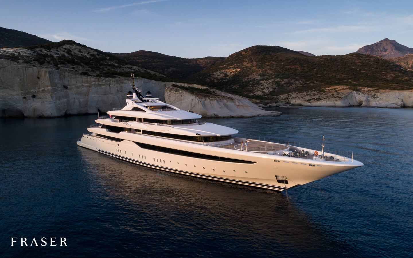 Luxury yacht cruising at golden hour