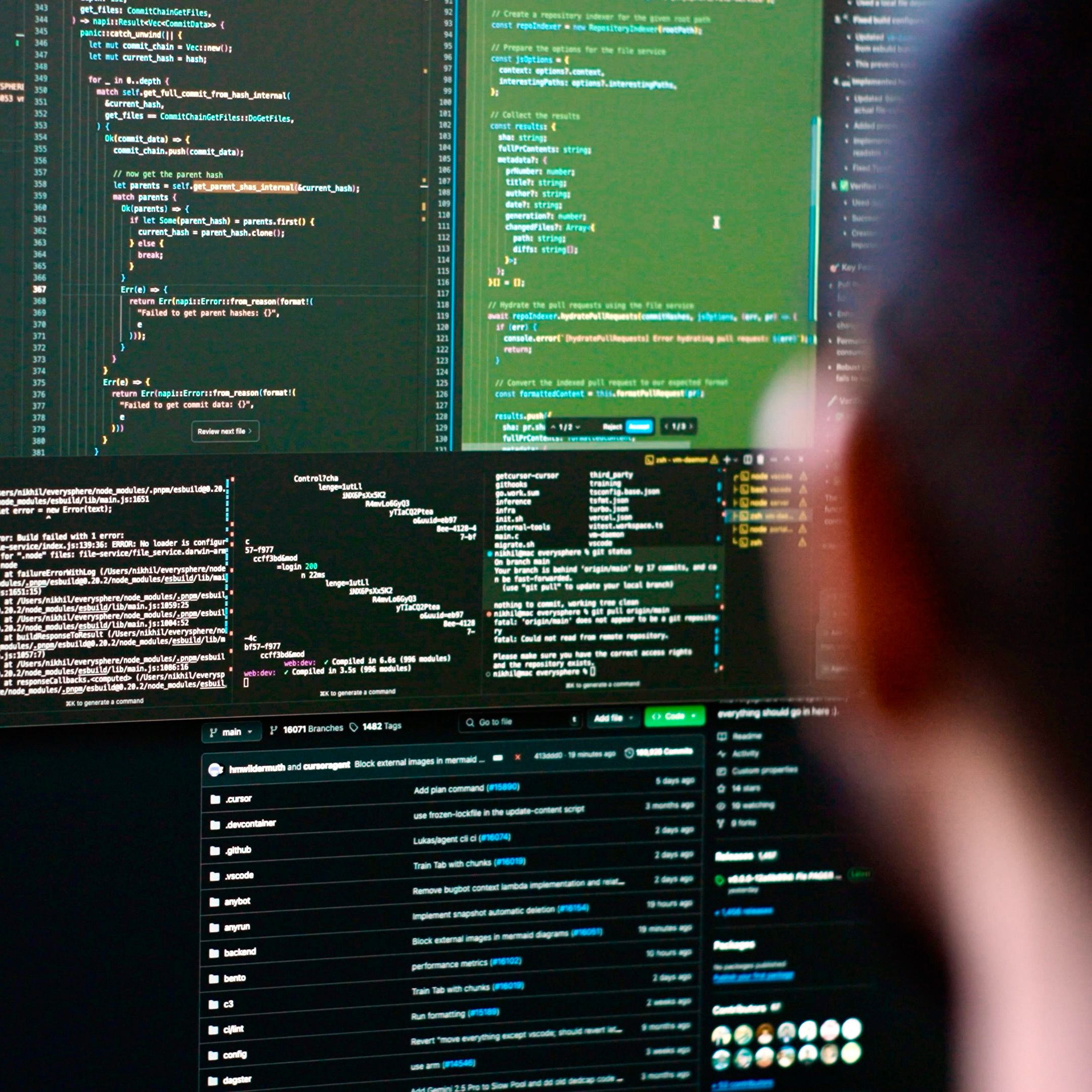 Developer working at multiple monitors