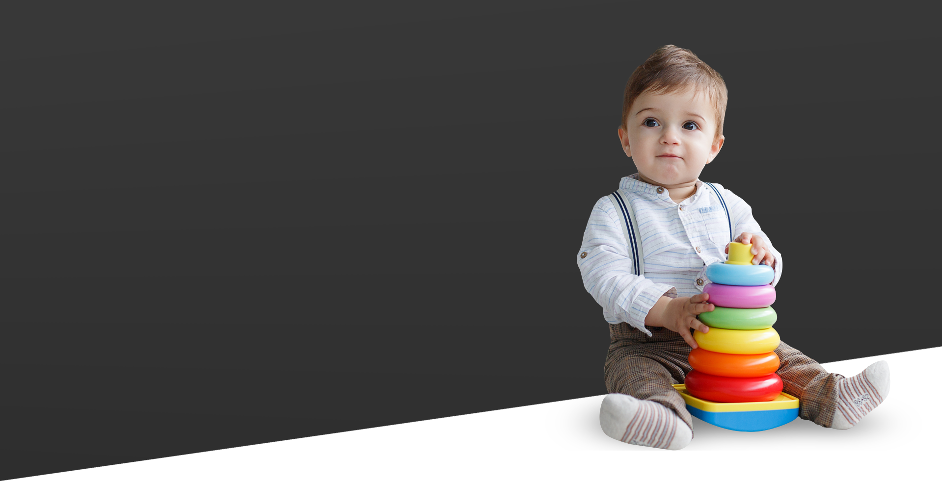 Baby playing with colorful stacking rings