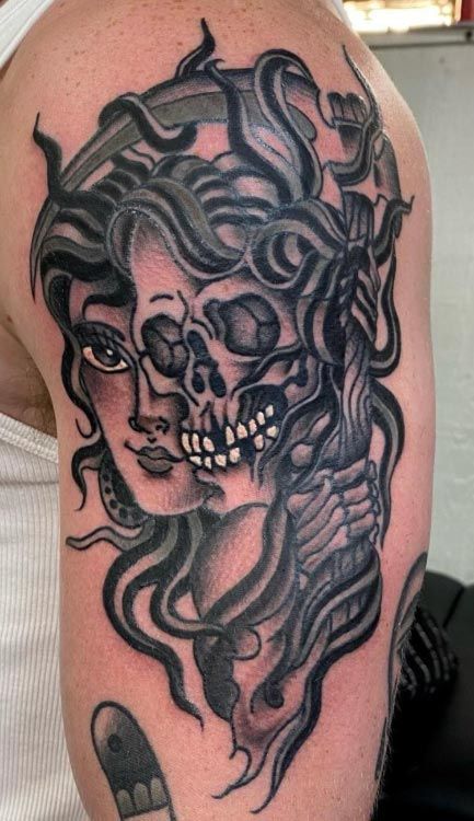 Skull and woman portrait tattoo