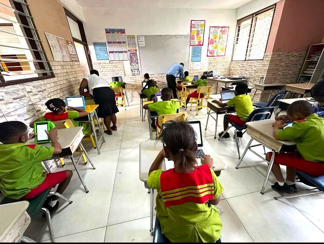 Students engaged in collaborative learning with technology integration