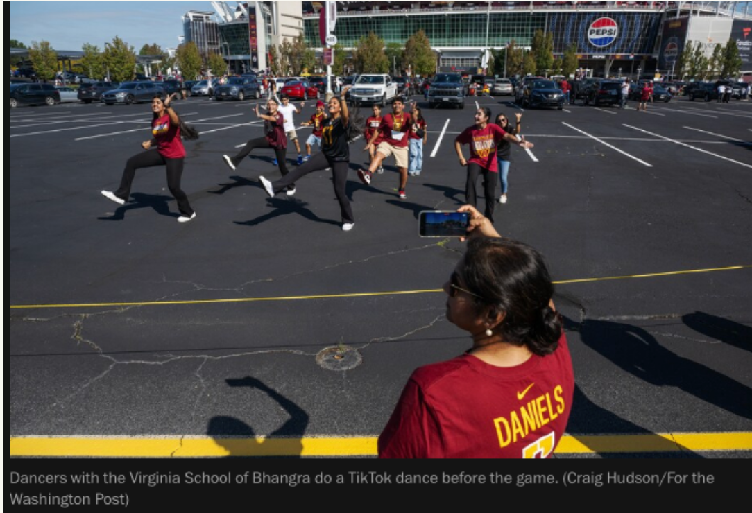 Dancers with the Virginia School of Bhangra do a TikTok dance before the game