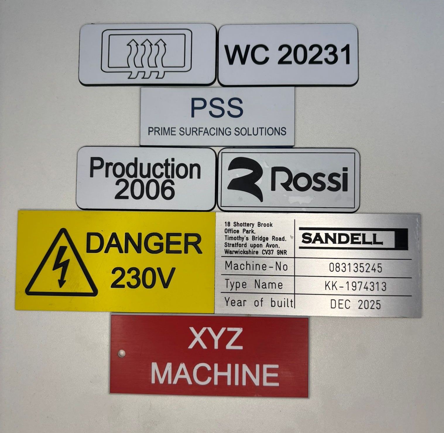 Rotary engraving examples - Industrial nameplates, warning signs, control panels, and machine labels