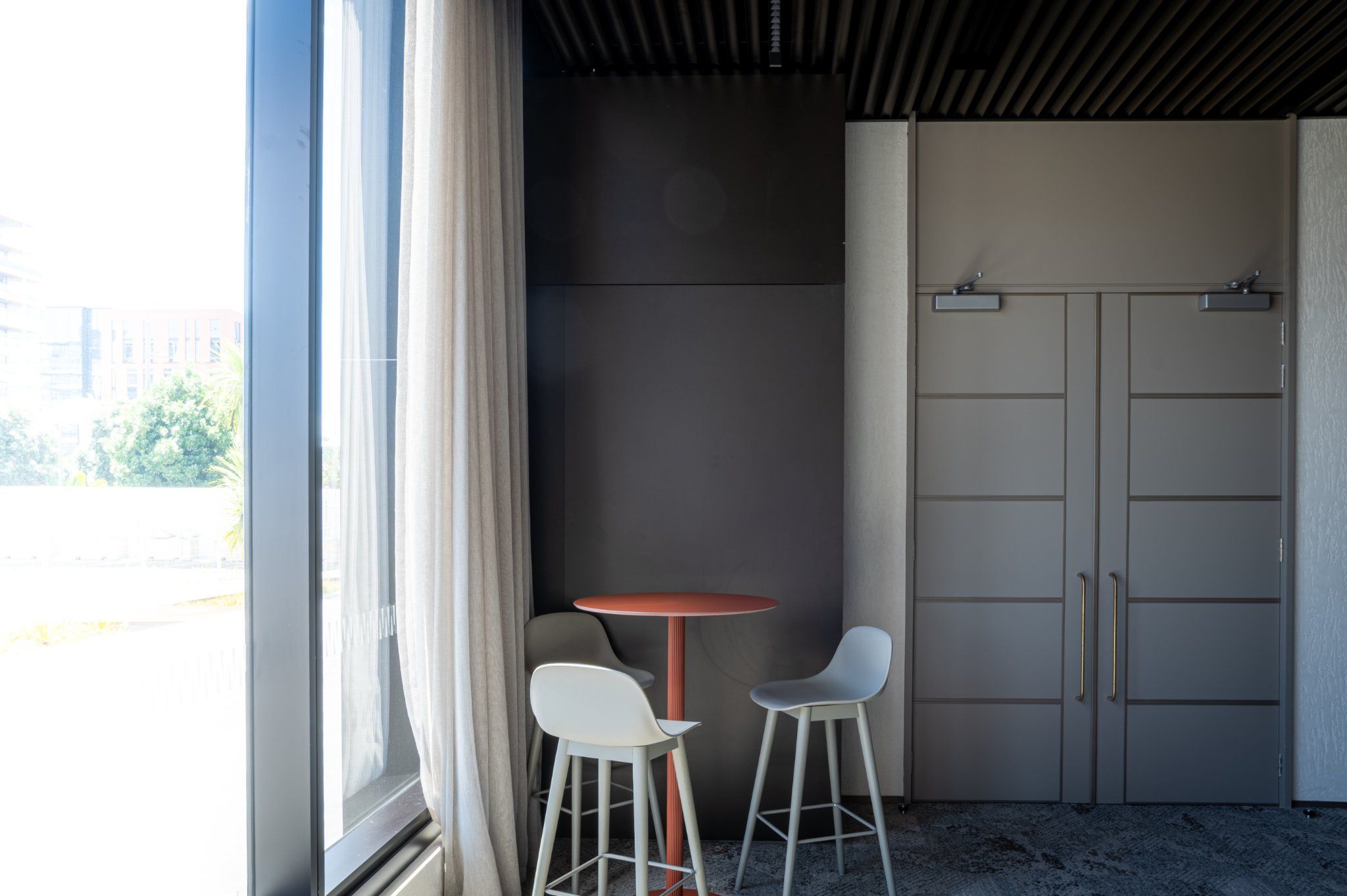 Function Room — informal seating area with floor-to-ceiling glass